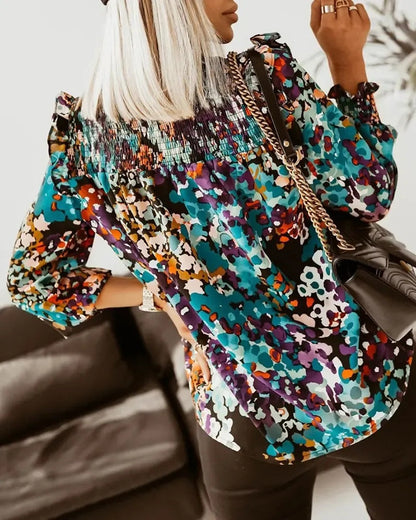 Xieyinshe - Long sleeve top with ruffled hem and all over print